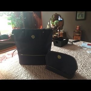 Purple handbag with additional small bag